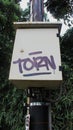 Ã¢â¬ÅTornÃ¢â¬Â word graffiti on a small electrical box